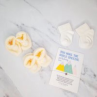 Cream baby booties with cotton socks and special wish bracelet