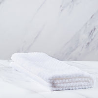 White polyester blanket.