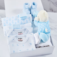Baby boy clothing gift set, inside a white magnetic box, packed with 2 baby vests, 2 muslins, 2 pairs of socks, acrylic booties, 2 pairs of mittens, cellular blanket and blue polka dot teddy bear toy.