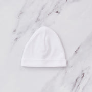 Plain white baby hat.