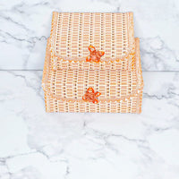 Two bamboo storage boxes, one medium and one large.
