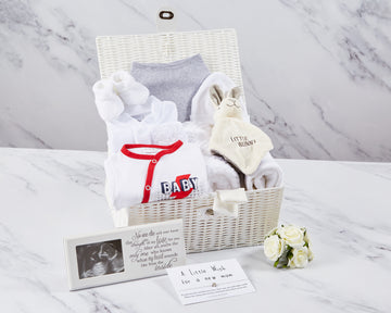 Unisex baby hamper in resin basket, 100% cotton baby clothes, photo frame, wish card & bunny toy. 