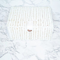 White resin basket with leather lock.