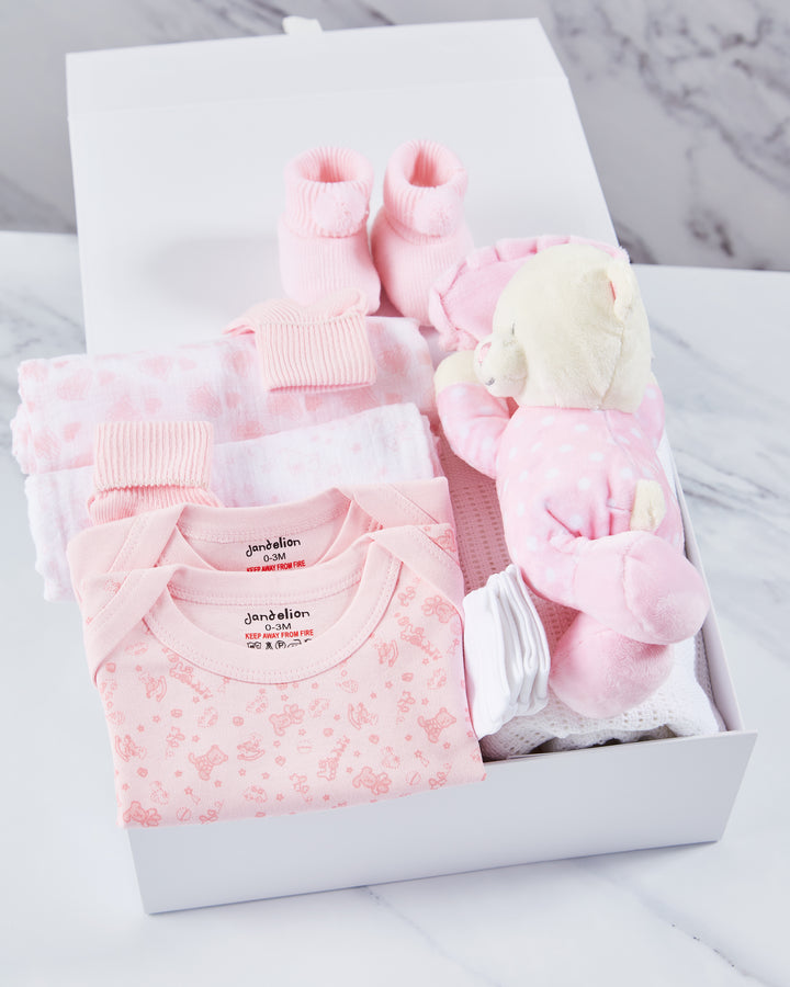 A collection of stunning Baby Girl Hampers, filled with adorable baby clothes and packaged in keepsake boxes. 