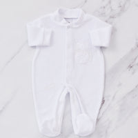 White embroidered baby sleepsuit. 
