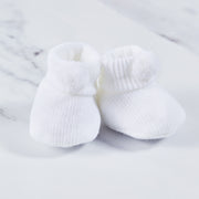 White acrylic baby booties.