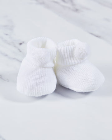 White acrylic baby booties.