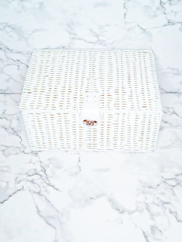 White resin basket with leather lock. 